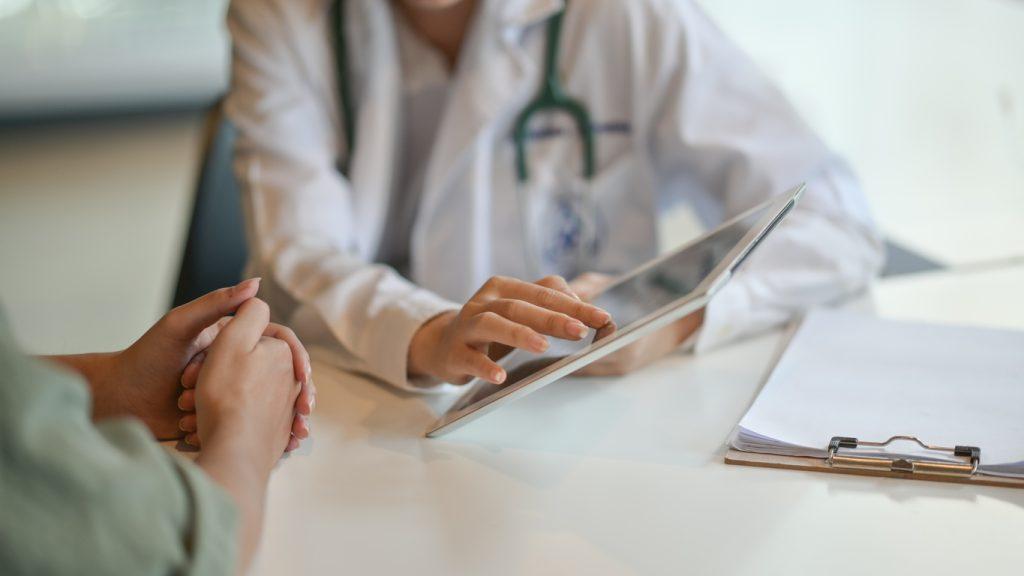 doctor sitting with patient