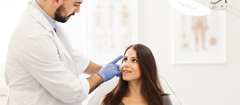 doctor performing a plastic surgery consultation