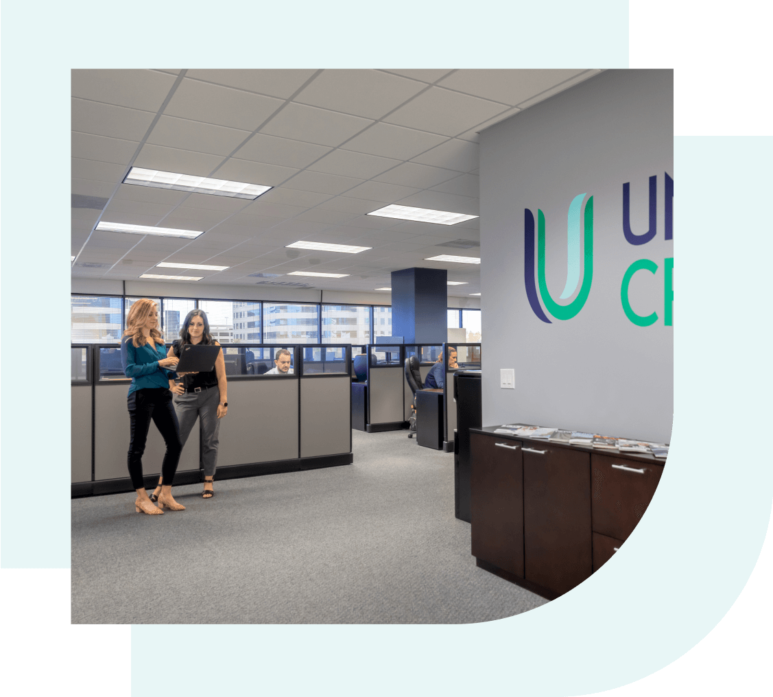 United Credit team members working at the office facility.