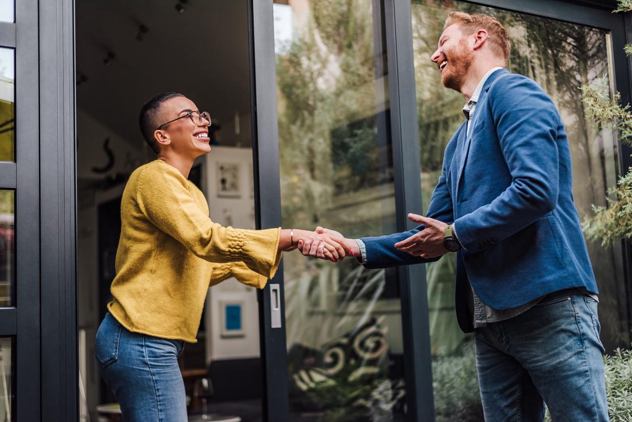 Shaking hands handshake greeting good old friend, client, job professional or new employee, two persons welcoming each other